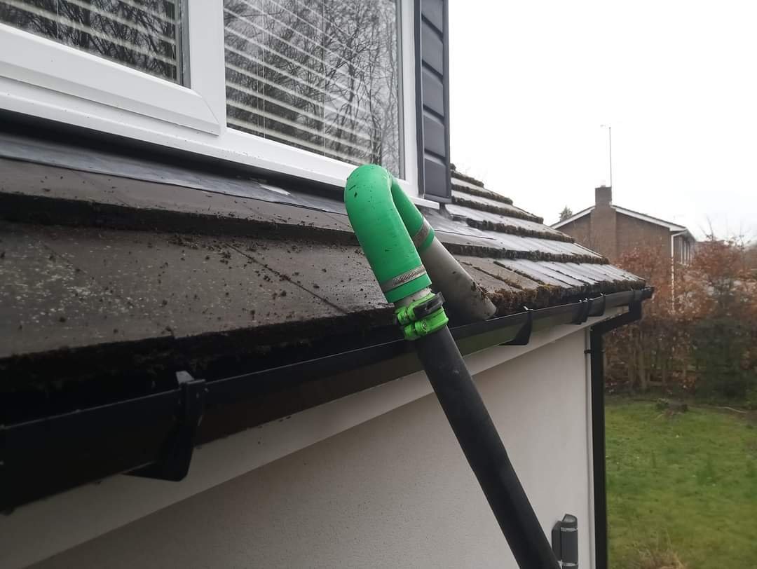 Gutter Vacuum Cleaning in Ashington — a downpipe flowing freely again, on a Northumberland local street